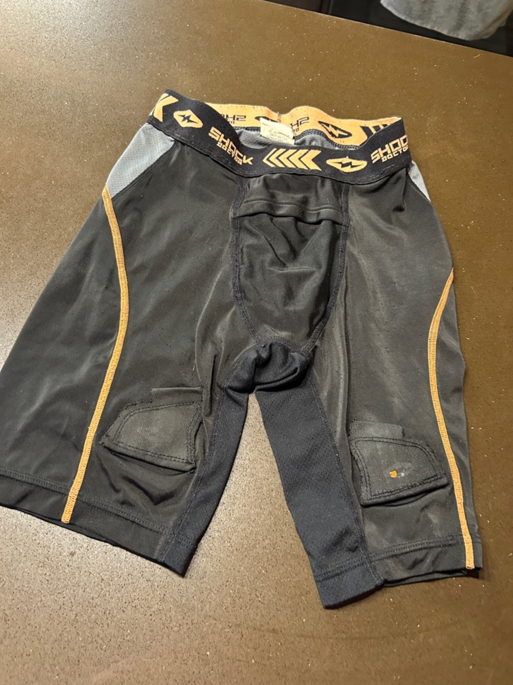Men's Black hockey jock with Gold Accents